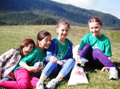 Girls on the Run participants smile outdoors 